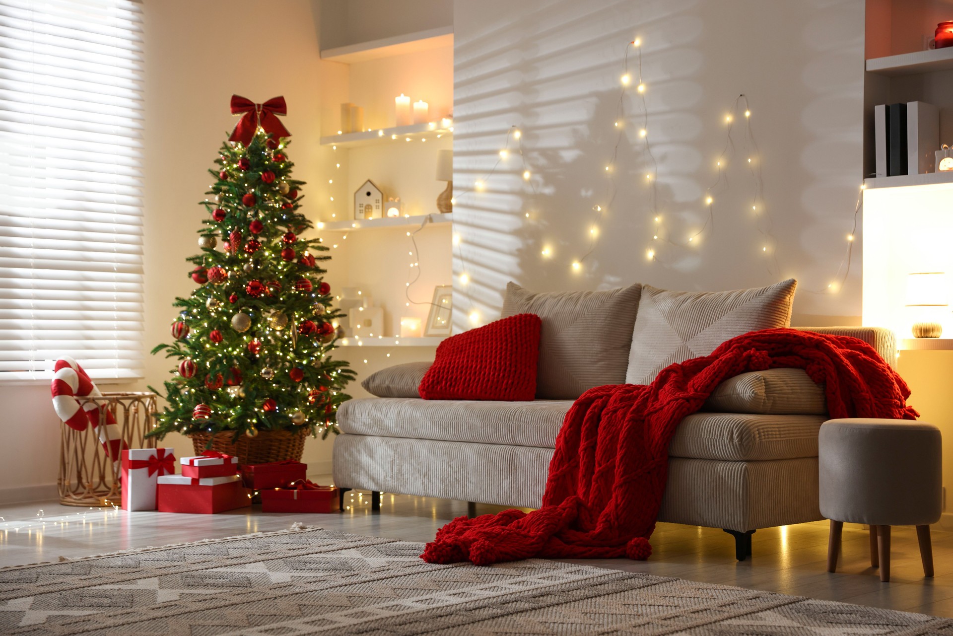 Beautiful Christmas tree and other decor in room. Festive interior design
