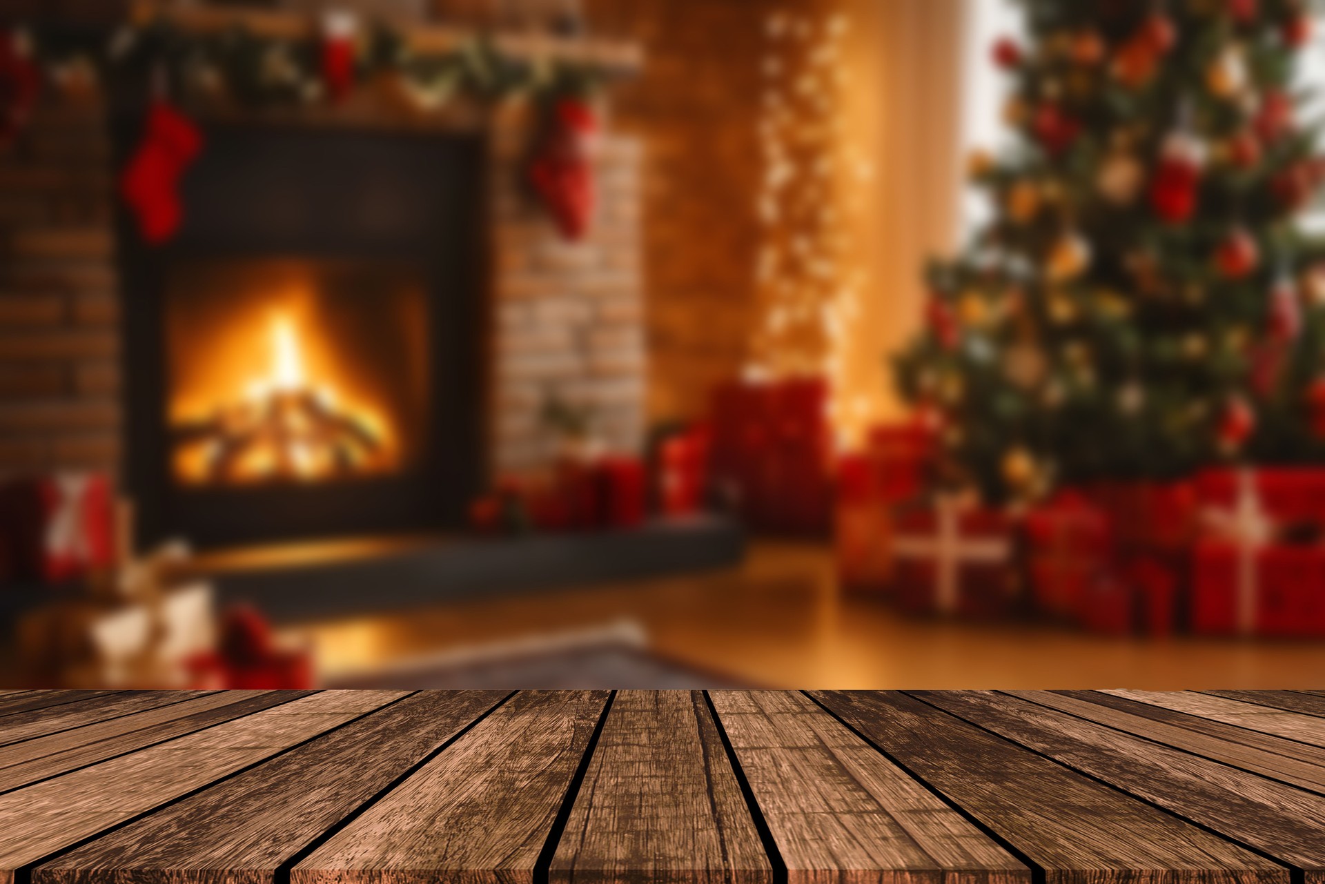 Christmas and New year background with empty dark wooden deck table over christmas tree and blurred light bokeh. Empty display for product montage. Rustic vintage Xmas background.